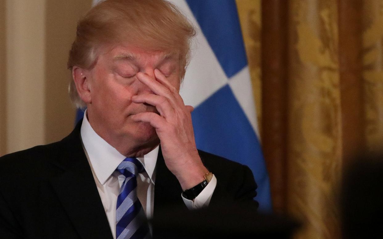 President Donald Trump hosts a Greek Independence Day celebration at the East room of the White House in Washington - REUTERS