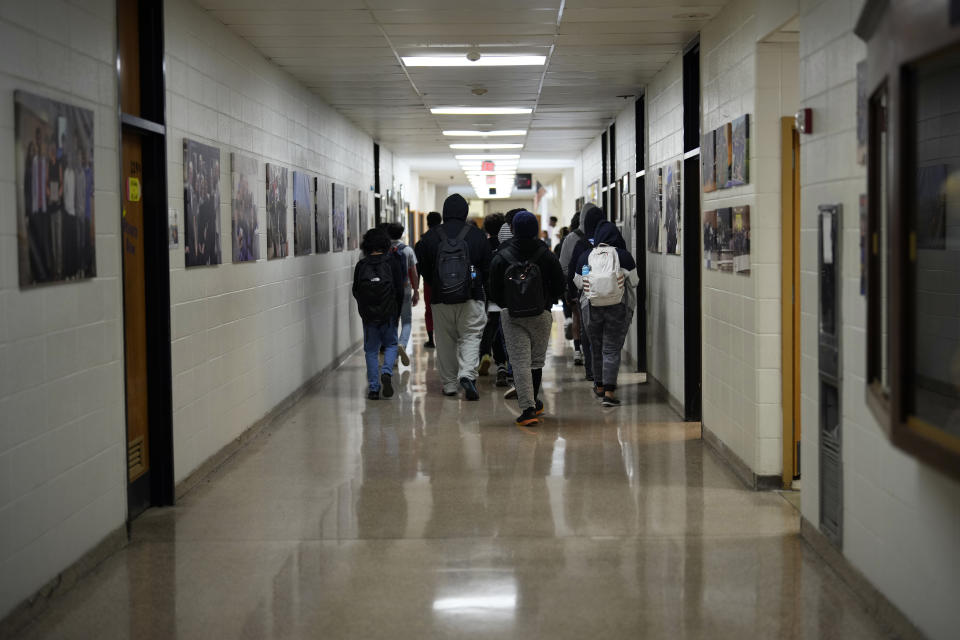 Students walk down a hallway at Upper Darby High School, Wednesday, April 12, 2023, in Drexel Hill, Pa. For some schools, the pandemic allowed experimentation to try new schedules. Large school systems including Denver, Philadelphia and Anchorage, Alaska, have been looking into later start times. (AP Photo/Matt Slocum)