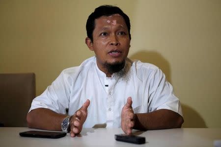 Agus Junaedi, who took over the vigilante wing of Team Hisbah after the death of its founder Sigit in 2011, gestures during an interview with Reuters in Solo, Indonesia Central Java province, August 10, 2016. REUTERS/Beawiharta/Files