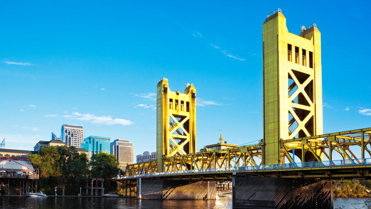 View at a Tower Bridge, a drawbridge built in 1935, and downtown Sacramento from West Sacramento side of the river.