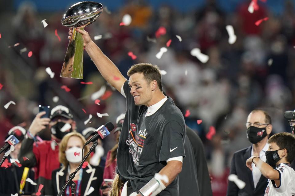 Despite what may have been his best efforts, Tom Brady had Nike logos plenty visible on the Super Bowl LV podium Sunday. (AP Photo/Lynne Sladky)