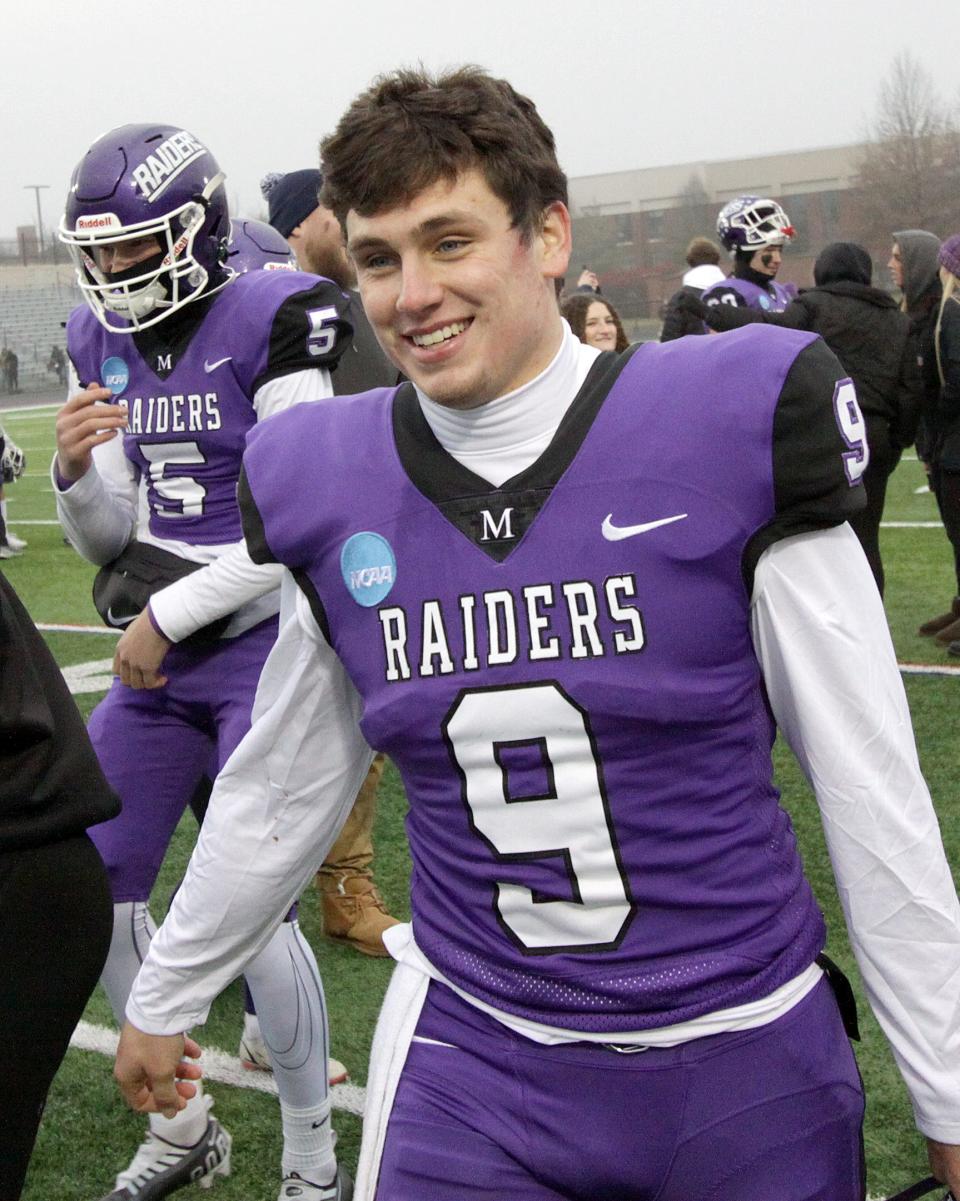 Mount Union quarterback Braxton Plunk on the field after the team's win over Wartburg during their Division III football semifinal at Kehres Stadium Saturday, December 10, 2022.