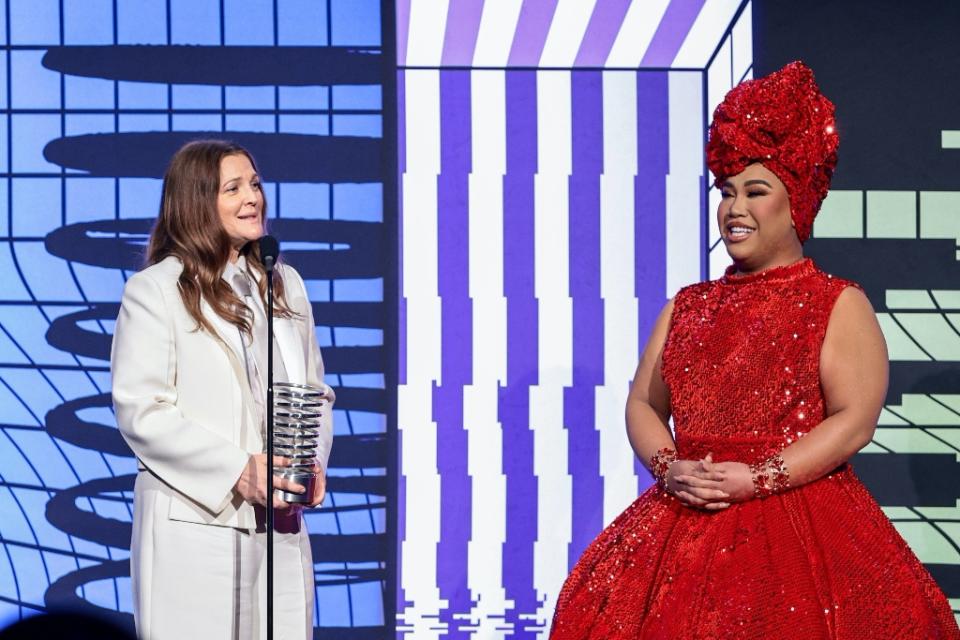 Barrymore accepting her award presented by Starrr at the 2022 Webby Awards on May 16. - Credit: Dimitrios Kambouris