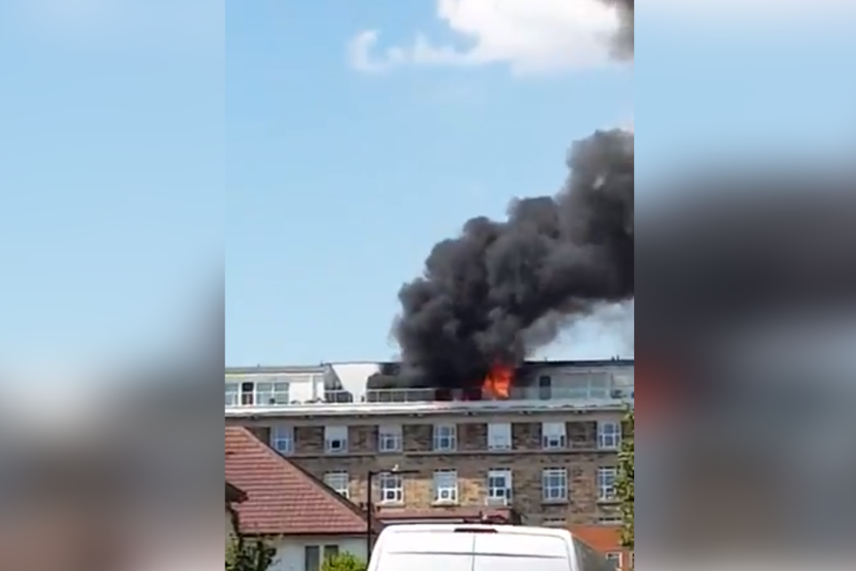 Flames and smoke could be seen pouring out of the six-storey building in east Acton. (Twitter / @Ry_nFleming)