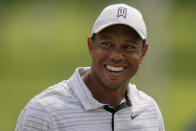 Tiger Woods smiles on the driving range before a practice round for the PGA Championship golf tournament, Tuesday, May 17, 2022, in Tulsa, Okla. (AP Photo/Eric Gay)