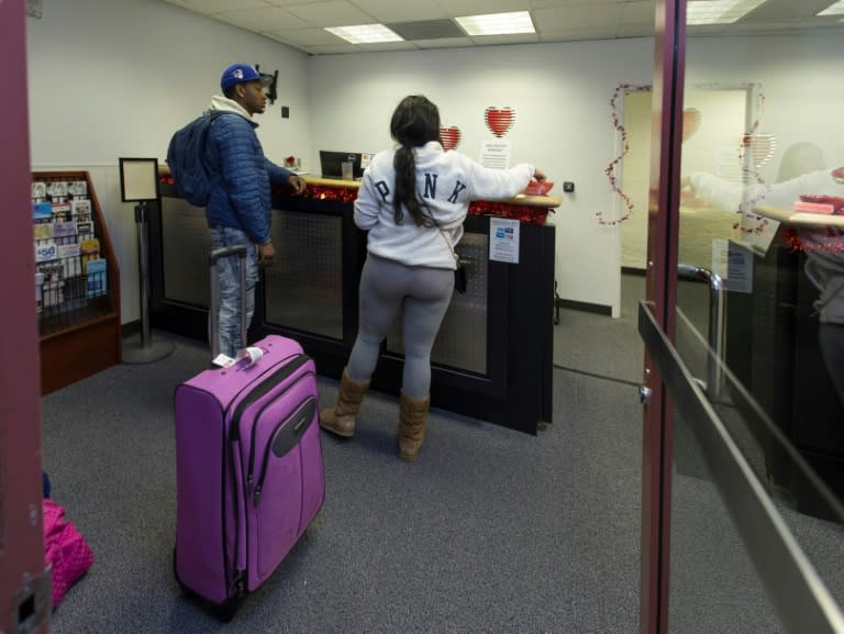 Teaira Thompson and James Anderson of Burlington, Iowa, complete their paperwork at the temporary marriage license office at McCarran International Airport in Las Vegas, which issues about 1,500 licenses on Valentine's Day