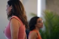 U.S. Rep. Nancy Mace, left, walks to the podium after former state Rep. Katie Arrington, right, gave her public support for her campaign on Thursday, June 16, 2022, in Charleston, S.C. Mace defeated the Trump-backed Arrington in South Carolina's 1st District Republican primary on Tuesday. (AP Photo/Meg Kinnard)