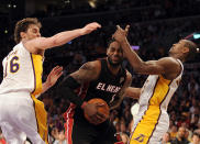 LOS ANGELES, CA - MARCH 04: LeBron James #6 of the Miami Heat drives to the basket between Metta World Peace #15 and Pau Gasol #16 of the Los Angeles Lakers during a 93-83 Laker win at Staples Center on March 4, 2012 in Los Angeles, California. NOTE TO USER: User expressly acknowledges and agrees that, by downloading and or using this photograph, User is consenting to the terms and conditions of the Getty Images License Agreement. (Photo by Harry How/Getty Images)