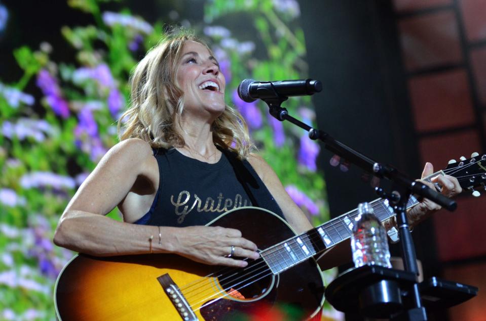 Sheryl Crow performs during the sold-out Farm Aid at Star Lake.