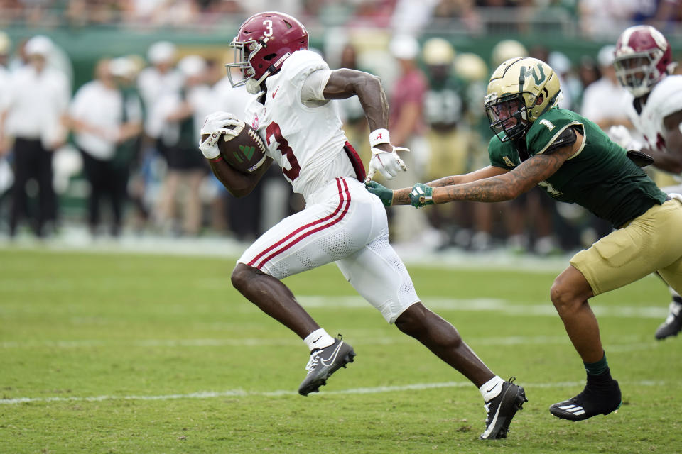Alabama wide receiver Jermaine Burton (3) gets past South Florida safety Matthew Hill (1) on a kick return during the first half of an NCAA college football game Saturday, Sept. 16, 2023, in Tampa, Fla. (AP Photo/Chris O'Meara)