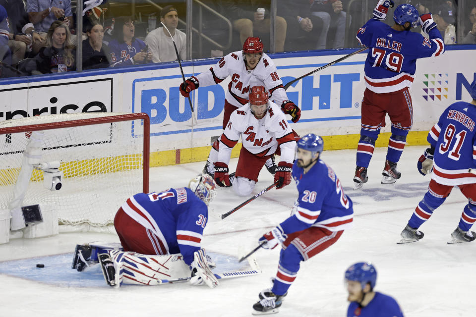 Carolina Hurricanes center Jordan Staal (11) is congratulated by Teuvo Teravainen (86) after scoring past New York Rangers goaltender Igor Shesterkin, left, in the third period during Game 5 of an NHL hockey Stanley Cup second-round playoff series Monday, May 13, 2024, in New York. (AP Photo/Adam Hunger)