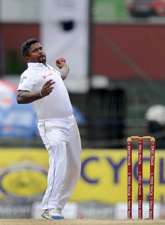 Rangana Herath delivers a ball during the third day of the second Test between Sri Lanka and South Africa in Colombo on July 26, 2014