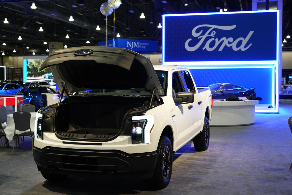 FILE - The Ford F-150 Lightning displayed at the Philadelphia Auto Show, Jan. 27, 2023, in Philadelphia. Ford Motor Co. is going through another round of white-collar job cuts as the company continues to reduce costs amid a transition to electric vehicles. (AP Photo/Matt Rourke, File)