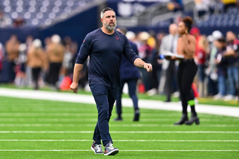 Houston Texans defensive coordinator Matt Burke walks on the field prior to a game against the Arizona Cardinals earlier this season.