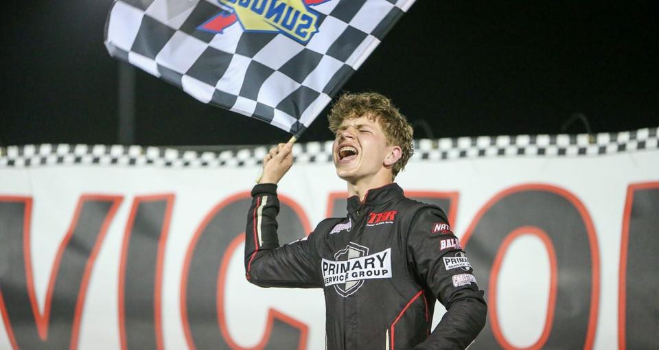 Luke Baldwin celebrates after winning the 602 Modified feature and championship during night 7 of the World Series of Asphalt Stock Car Racing event at New Smyrna Speedway in New Smyrna, Florida on February 17, 2023. (Adam Fenwick/NASCAR)