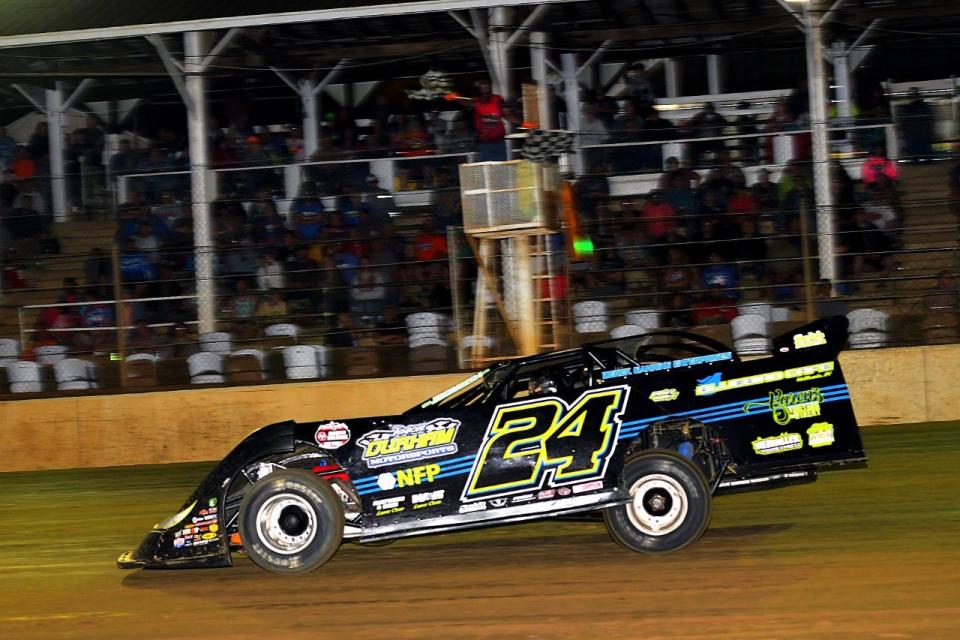 Bedford's Jared Bailey takes the checkered flag Saturday night to win the 8th annual Paul Crockett Memorial in 2021 at Brownstown Speedway Saturday night.