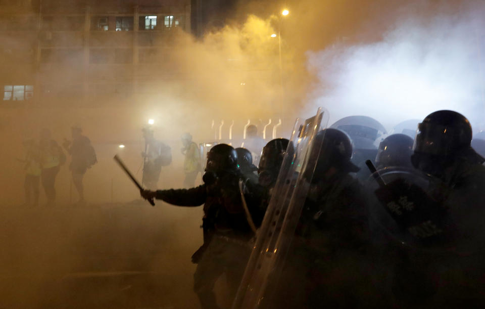 Riot police faces anti-extradition bill demonstrators amidst tear gas, after a march to call for democratic reforms, in Hong Kong, China July 21, 2019. (Photo: Tyrone Siu/Reuters)