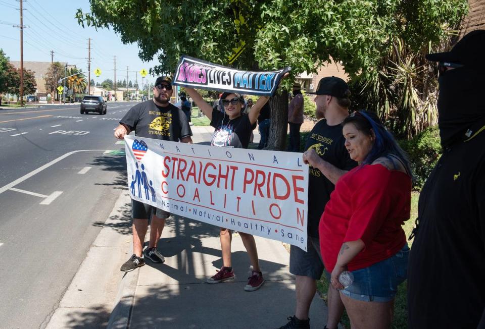 Straight Pride coalition members rally outside a family planning center on Coffee Road in Modesto, Calif., on Saturday, August 27, 2022.