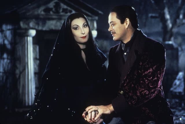 <p>Paramount/Kobal/Shutterstock</p> Anjelica Huston and Raul Julia in 'Addams Family Values'.