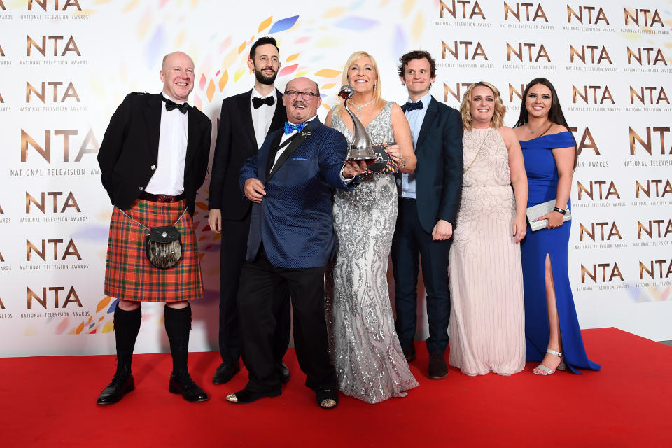 Brendan O'Carroll, BBC Head of Comedy Josh Cole, Jennifer Gibney and cast members, accepting the Comedy award for "Mrs Brown's Boys", pose in the winners room  during the National Television Awards 2020 at The O2 Arena on January 28, 2020 in London, England. (Photo by Gareth Cattermole/Getty Images)