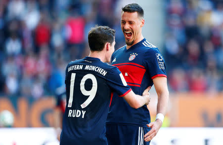 Soccer Football - Bundesliga - FC Augsburg vs Bayern Munich - WWK Arena, Augsburg, Germany - April 7, 2018 Bayern Munich's Sandro Wagner celebrates scoring their fourth goal with Sebastian Rudy REUTERS/Michaela Rehle