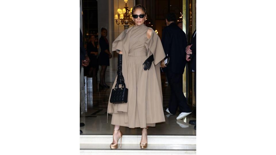 A pair of leather gloves and a Lady Dior bag complemented the Dior ensemble