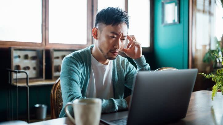 A man looks over his finances. 