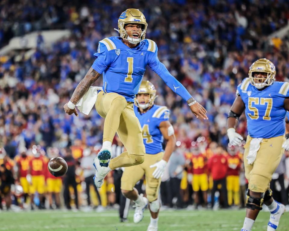 UCLA quarterback Dorian Thompson-Robinson celebrates after scoring a touchdown against USC during the Trojans' 48-45 win on Saturday night at the Rose Bowl.