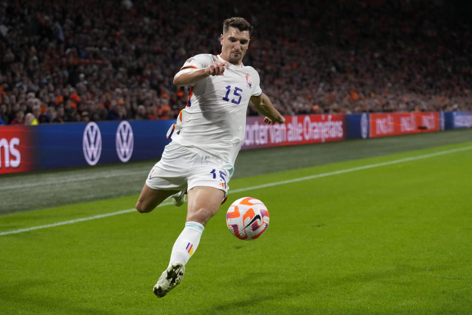 Belgium's Thomas Meunier tarries to control the ball during the UEFA Nations League soccer match between the Netherlands and Belgium at the Johan Cruyff ArenA in Amsterdam, Netherlands, Sunday, Sept. 25, 2022. (AP Photo/Peter Dejong)