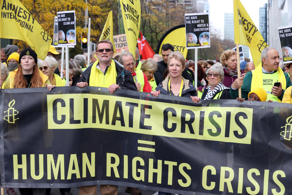 protesters march in Brussels prior to the U.N. Climate Summit