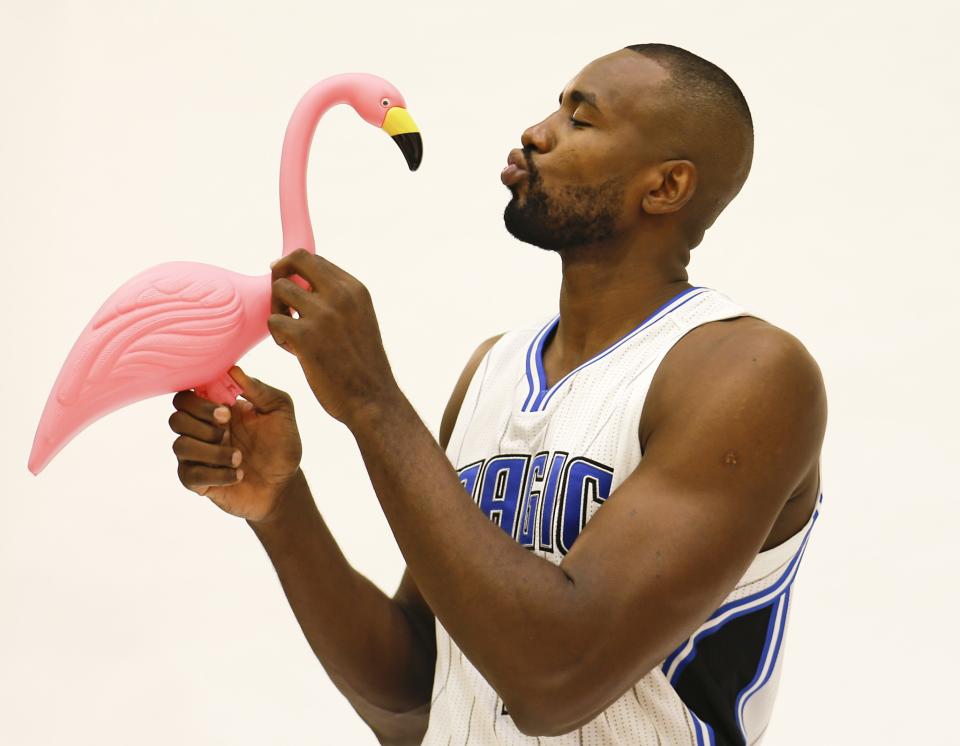 <p>Of course Serge Ibaka is kissing a flamingo. (AP) </p>