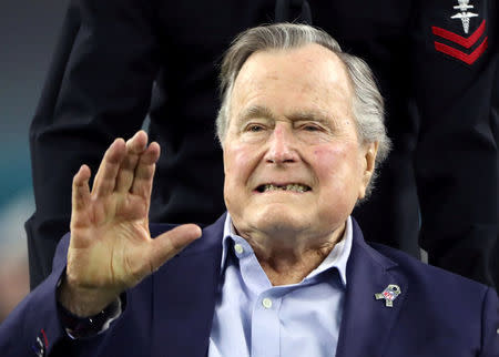 FILE PHOTO: Former U.S. President George H.W. Bush arrives on the field to do the coin toss ahead of the start of Super Bowl LI between the New England Patriots and the Atlanta Falcons in Houston, Texas, U.S. on February 5, 2017. REUTERS/Adrees Latif/File Photo