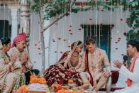 <p>The decor of a traditional Indian wedding is dramatic, bold, and festive in the most otherworldly of ways. Guests can expect the most jaw-dropping display of color, but it's the fine details that stand out—even at a ceremony packed with plush textures, embroidered fabrics, and vibrant hues. </p><p>Take the dangling blooms and candles at Diipa and Oleg's wedding (pictured here), which add texture and visual interest to the look of their mandap, and would just as beautifully complement any wedding altar. Choose a bloom or ornament that works for your color palette, floral design, and overall look. Then, take notes from this ceremony, where fluttering blooms and candles worked to create "walls" around the couple and their family, making the space feel simultaneously intimate and open.<br></p><p><em>Pictured: <a href="https://www.harpersbazaar.com/wedding/photos/a25397587/diipa-khosla-oleg-buller-wedding/" rel="nofollow noopener" target="_blank" data-ylk="slk:Diipa and Oleg's 4-day Wedding in India;elm:context_link;itc:0;sec:content-canvas" class="link ">Diipa and Oleg's 4-day Wedding in India</a>; Planning by <a href="https://www.ankit.in/" rel="nofollow noopener" target="_blank" data-ylk="slk:Ankit;elm:context_link;itc:0;sec:content-canvas" class="link ">Ankit</a>; Design and florals by <a href="http://www.altair-decor.com/" rel="nofollow noopener" target="_blank" data-ylk="slk:Alt Air;elm:context_link;itc:0;sec:content-canvas" class="link ">Alt Air</a>. </em></p>