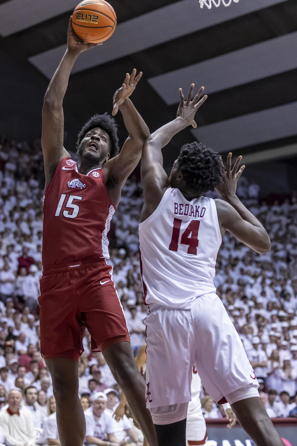 Arkansas forward Makhi Mitchell (15) shoots over Alabama center Charles Bediako (14) during the first half of an NCAA college basketball game, Saturday, Feb. 25, 2023, in Tuscaloosa, Ala. (AP Photo/Vasha Hunt)