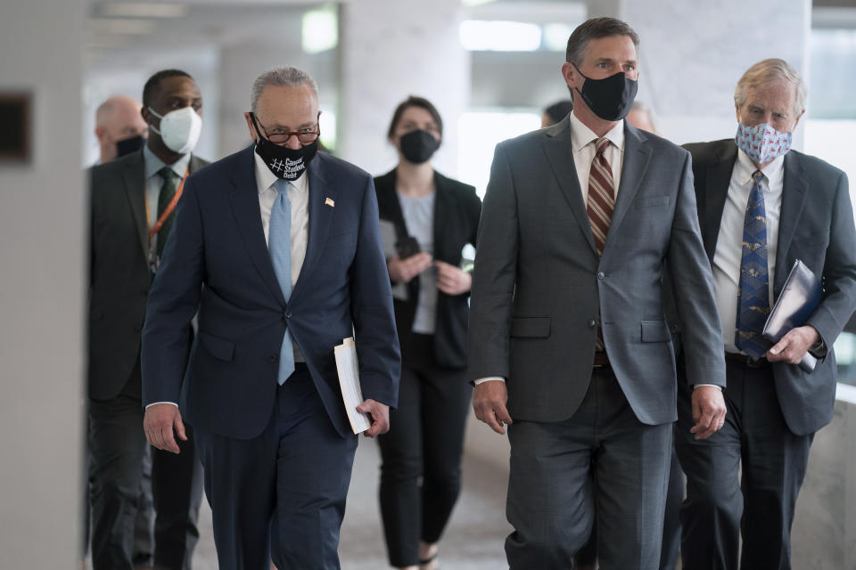 From left, Senate Majority Leader Chuck Schumer, D-N.Y., Sen. Martin Heinrich, D-N.M., and Sen. Angus King, I-Maine, arrive to talk to reporters after a weekly Democratic strategy session, on Capitol Hill in Washington, Tuesday, April 27, 2021, the day before President Joe Biden will address House and Senate lawmakers for the first time in his presidency. (AP Photo/J. Scott Applewhite)