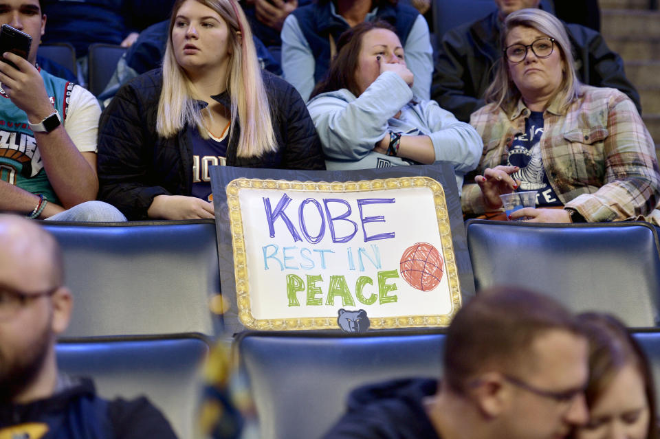 A sign reading "Kobe Rest In Peace" is displayed on an empty seat in the first half of a basketball game between the Phoenix Suns and the Memphis Grizzlies, Sunday, Jan. 26, 2020, in Memphis, Tenn. Former NBA player Kobe Bryant died in a California helicopter crash Sunday. (AP Photo/Brandon Dill)