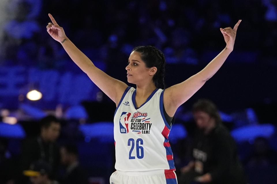 Actress and YouTuber Lilly Singh celebrates following the NBA basketball All-Star Celebrity Game, Friday, Feb. 16, 2024, in Indianapolis. (AP Photo/Darron Cummings)