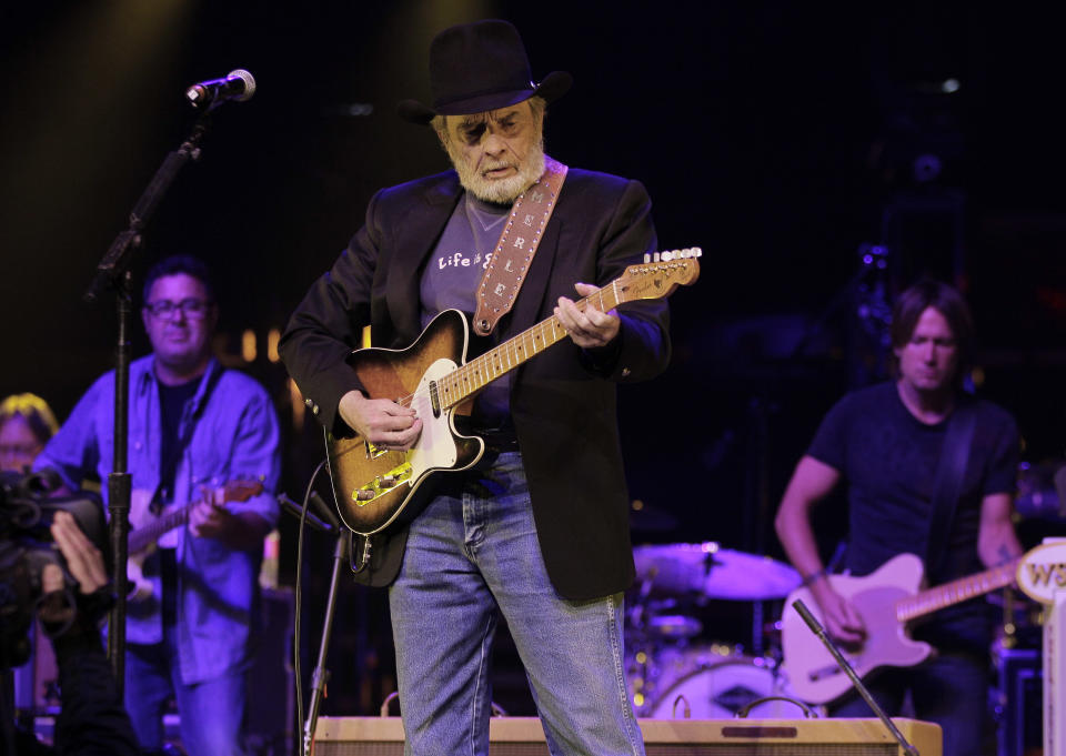 Merle Haggard, center, performs with Vince Gill, left, and Keith Urban, right, during the All for the Hall concert on Tuesday, April 10, 2012, in Nashville, Tenn. The concert is a benefit for the Country Music Hall of Fame and Museum. (AP Photo/Mark Humphrey)