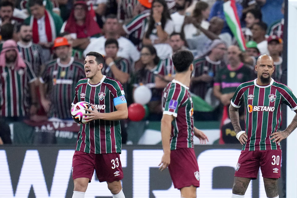 Fluminense's Nino, left, and Felipe Melo, right, react after Manchester City's Julian Alvarez scored the opening goal during the Soccer Club World Cup final match between Manchester City FC and Fluminense FC at King Abdullah Sports City Stadium in Jeddah, Saudi Arabia, Friday, Dec. 22, 2023. (AP Photo/Manu Fernandez)