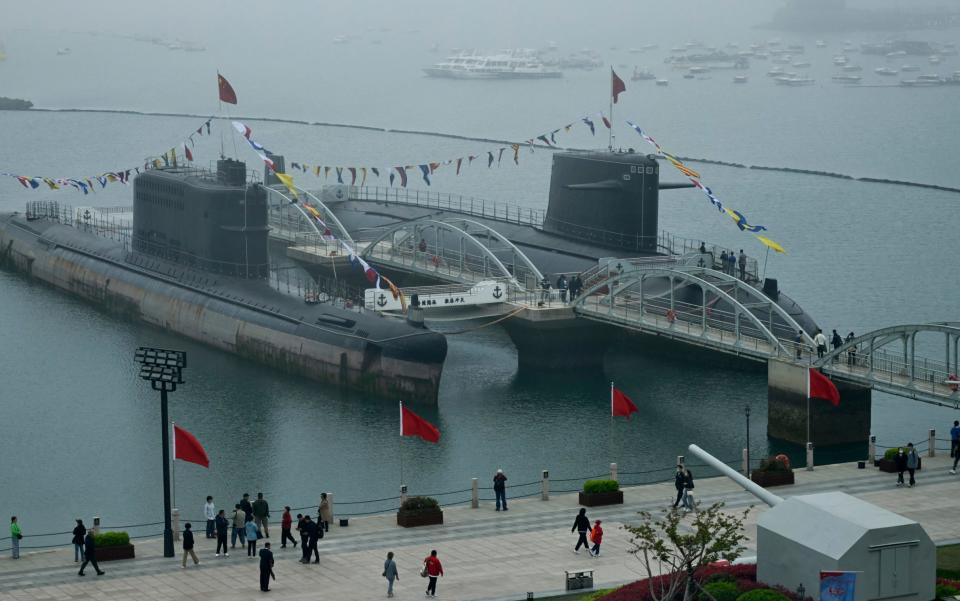 Two submarines mark the 75th founding anniversary of the People's Liberation Army in  Qingdao in April