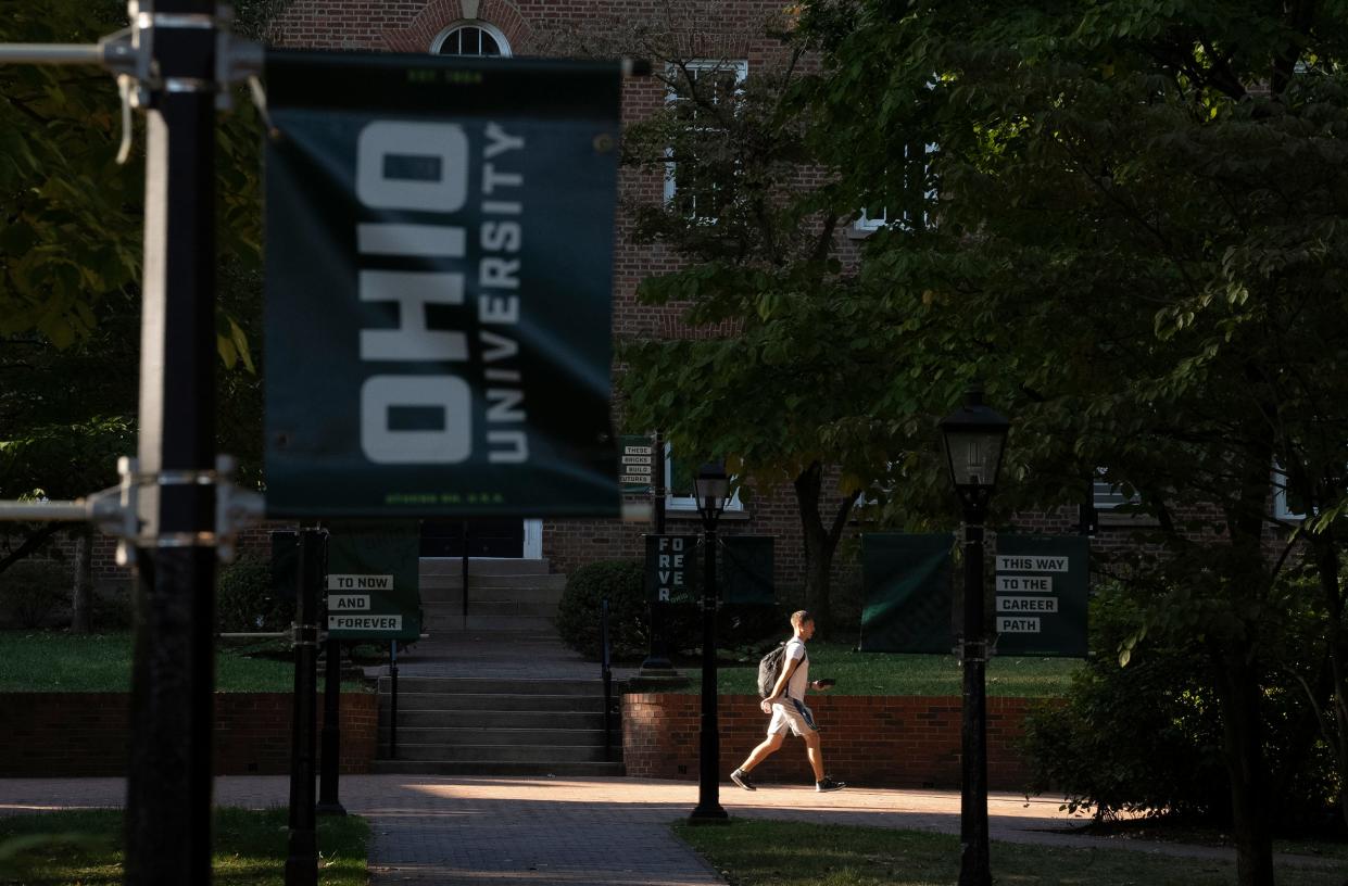 Students walk on College Green at the Ohio University Campus.