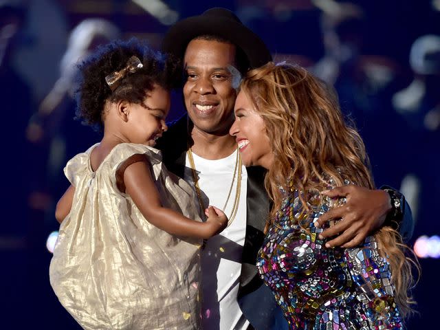 <p>Kevin Winter/MTV1415/Getty</p> Beyoncé onstage with her eldest daughter Blue Ivy Carter and husband JAY-Z during the 2014 MTV Video Music Awards