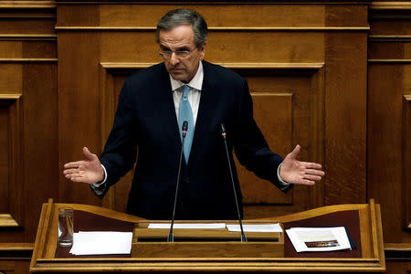 Former Greek Prime Minister Antonis Samaras addresses lawmakers during a parliamentary session before a vote on setting up a special committee which will probe the role of ten politicians in a case which involves alleged bribery by Swiss drugmaker Novartis, in Athens, Greece, February 21, 2018. REUTERS/Alkis Konstantinidis