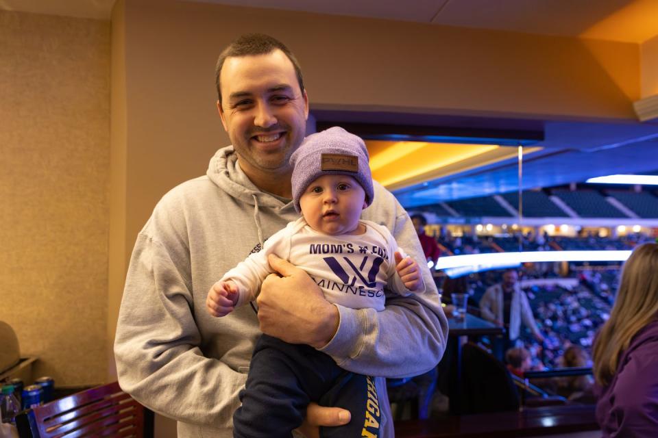 a man holding a baby