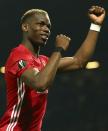<p>Manchester United’s Paul Pogba celebrates after the end of the Europa League semifinal second leg soccer match between Manchester United and Celta Vigo at Old Trafford </p>