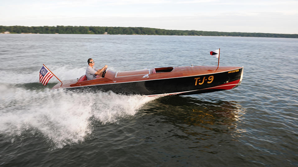 John N. Allen drives his 1926 Hacker Craft 22-foot Black Jack. - Credit: Jim Wangard