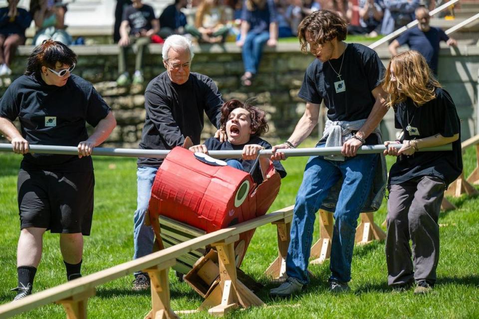 Jaxson Sutter’s cardboard vehicle goes off the rail at Rail Day, a tradition at the Kansas City Art Institute started in 1996. Cardboard, glue and imagination are combined to create vehicular sculptures that hopefully make it 80 feet down a wooden rail.