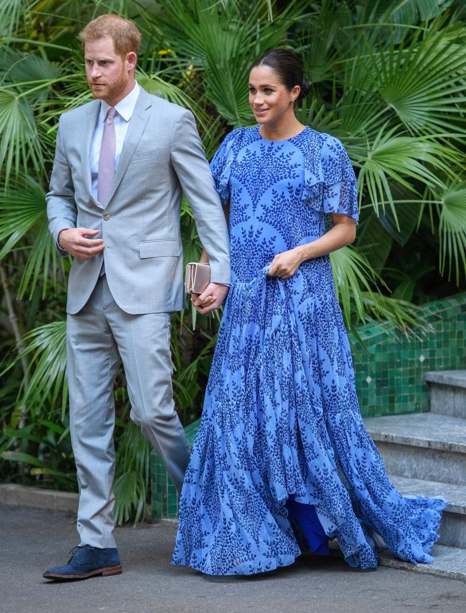 The couple finished up their <a href="https://people.com/royals/meghan-markle-prince-harry-morocco-royal-tour/" rel="nofollow noopener" target="_blank" data-ylk="slk:three-day tour of Morocco;elm:context_link;itc:0;sec:content-canvas" class="link ">three-day tour of Morocco</a> with a visit with Mohammed VI, the King of Morocco, at a royal residence. Meghan chose a bespoke dress by Carolina Herrera, a blue-patterned ensemble with flowing sleeves — and Prince Harry matched with blue suede shoes!