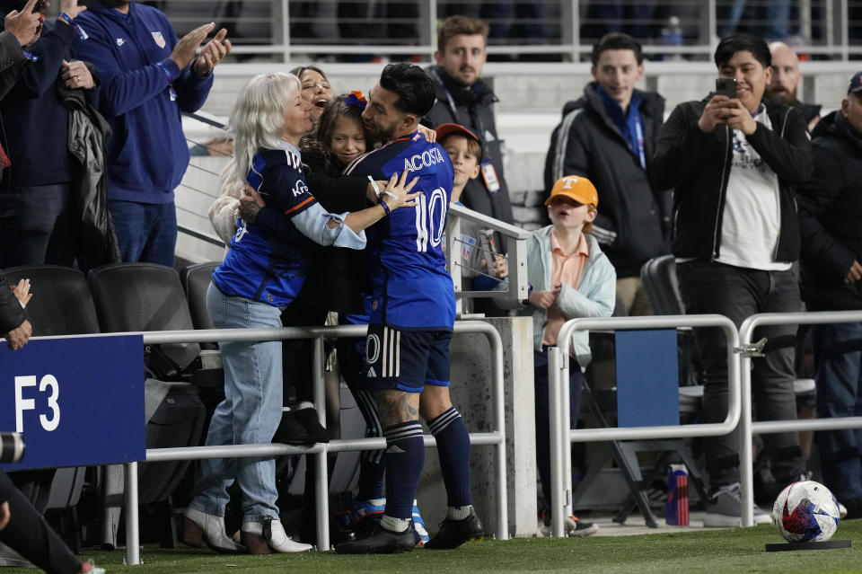 FC Cincinnati midfielder Luciano Acosta (10) celebrates with his family after scoring on a free kick during the first half of an MLS Eastern Conference final soccer match against the Columbus Crew, Saturday, Dec. 2, 2023, in Cincinnati. (AP Photo/Carolyn Kaster)