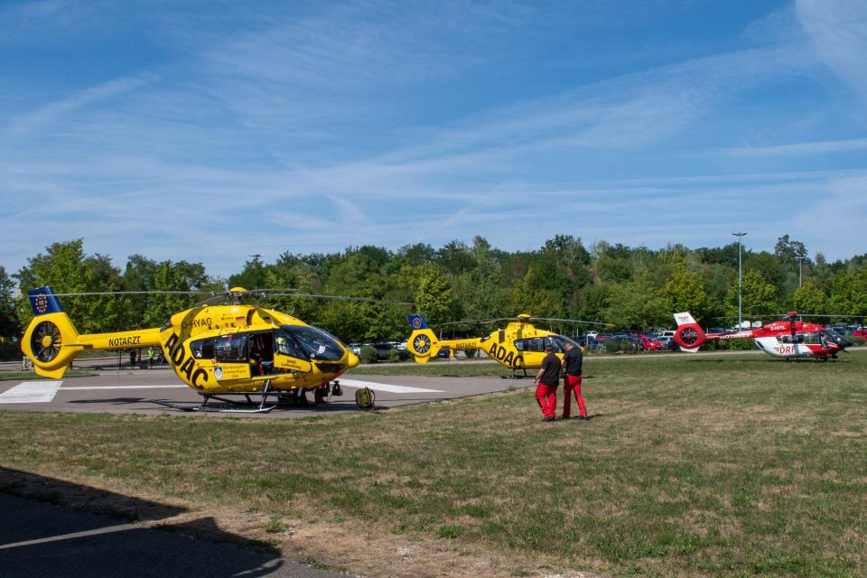 Rescue helicopters are seen in a field near Legoland. At least 34 people were injured in the accident on a roller coaster at Legoland in Günzburg, Swabia, two of them seriously.